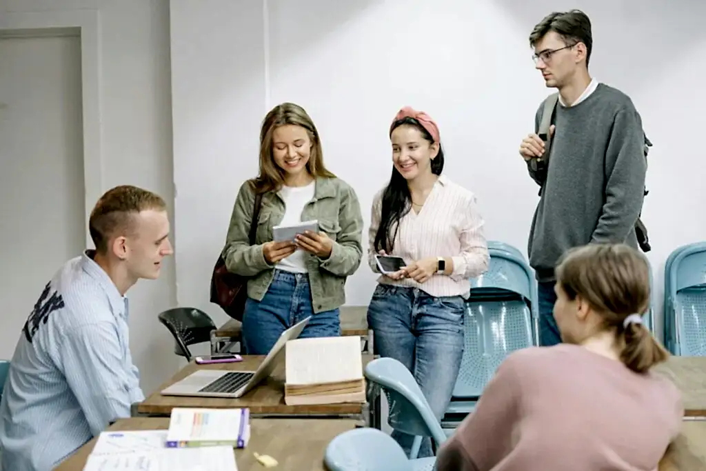 A diverse group of college students engaging in a lively study session indoors.